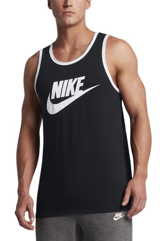 Men's Nike Sportswear Ace Logo Graphic Tank Top. This Nike tank top is made with 100% cotton in a standard fit to give you optimal comfort. Whether you're on the court or at the beach, this Nike tank is perfect for soaking up the sun in style. With a large logo and relaxed feel, enjoy all your adventures this season in the Men's Nike Sportswear Athletic Cut Tank Top.