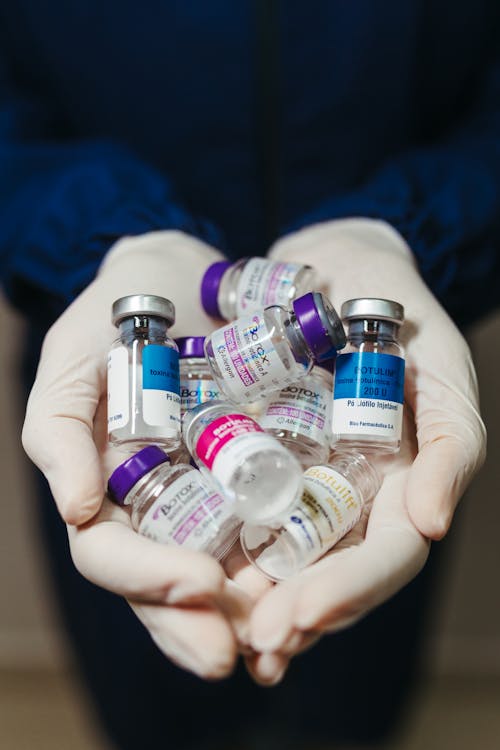 Free Botox Flasks on Doctor Hands Stock Photo