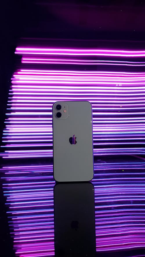 Free Phone Displayed on Neon Background Stock Photo