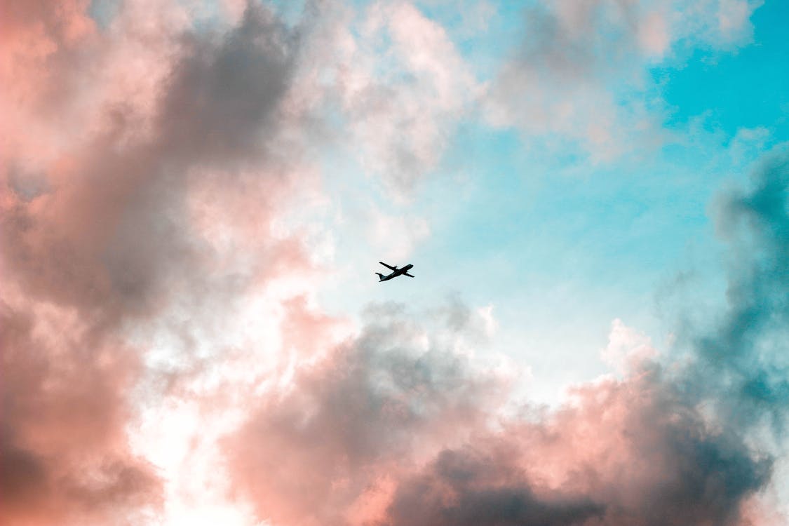 Free Silhouette of Airplane Under Cloudy Sky Stock Photo