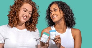 Two women holding Happy V wellness products in a bright lifestyle scene