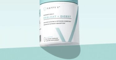 Happy V Debloat + Digest supplement bottle on a colored background