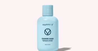 Happy V Feminine Wash bottle on a gray background