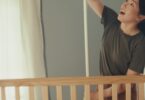 Nanit baby monitor in a nursery scene