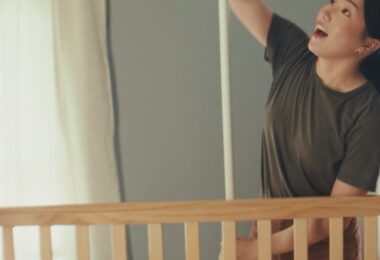 Nanit baby monitor in a nursery scene