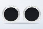 ST Dupont round black lacquer cufflinks on a light background
