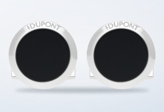 ST Dupont round black lacquer cufflinks on a light background