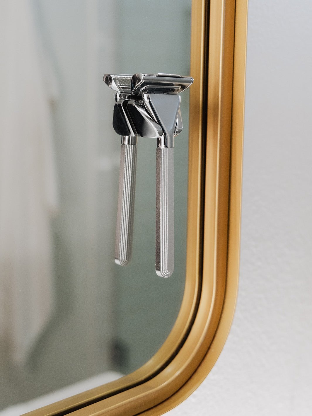 Supply Single Edge MAX razor mounted on a bathroom wall