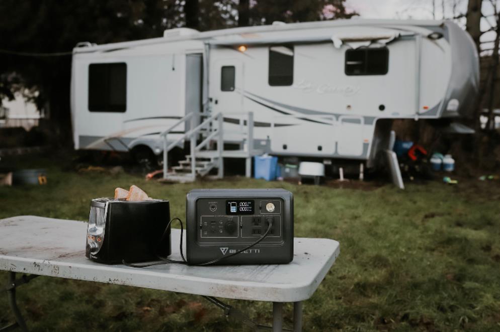 Portable power station arranged beside a recreational vehicle