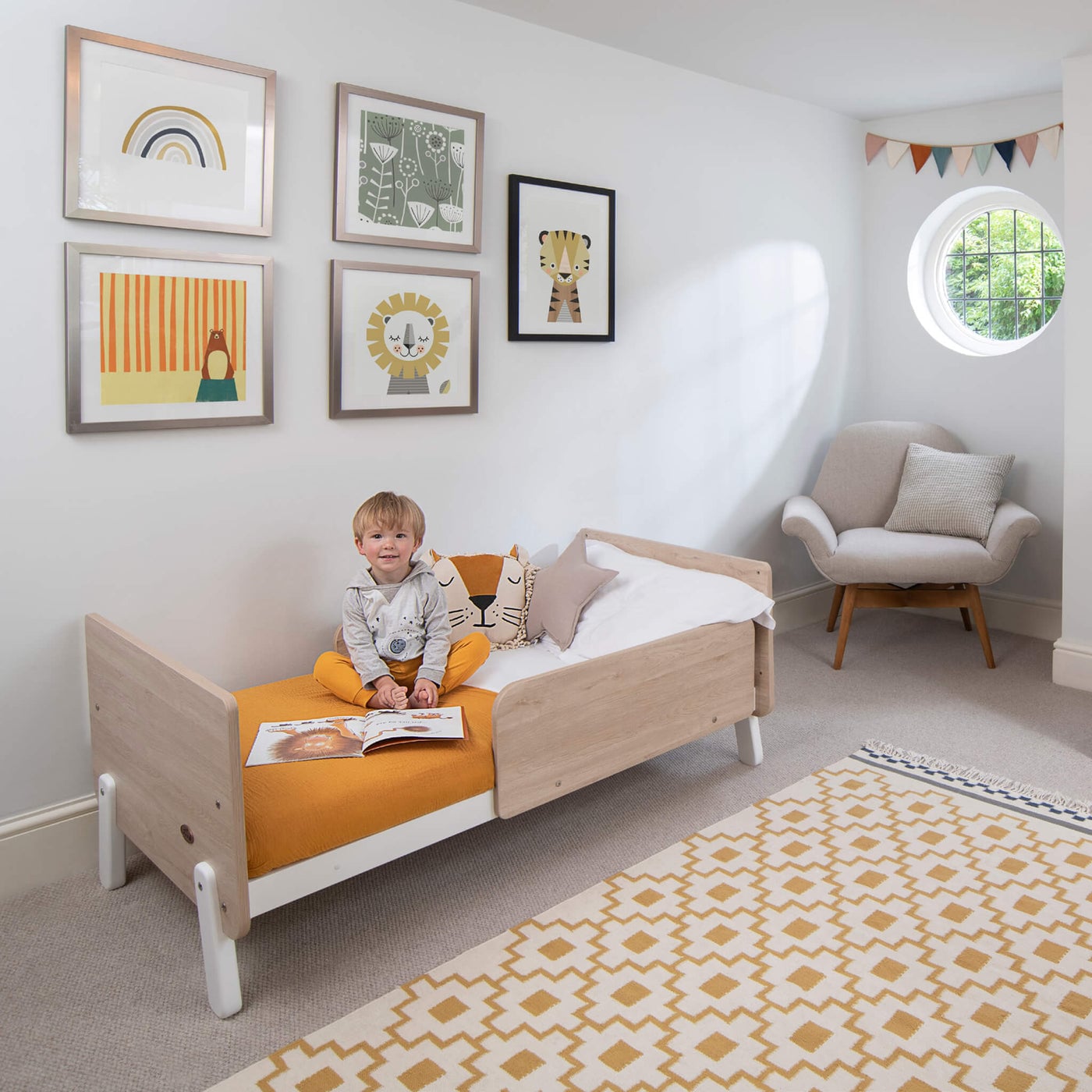 Natty cot bed in a styled nursery