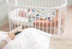 Boori Oasis Oval Cot in a nursery setting
