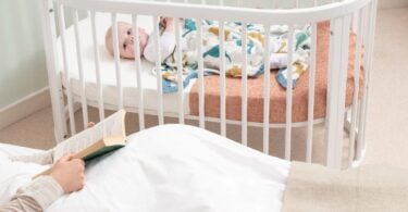Boori Oasis Oval Cot in a nursery setting