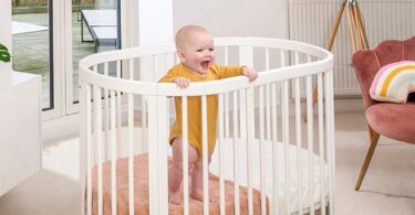 Boori Oasis Oval Cot in a nursery room