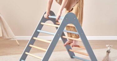 Child climbing a Boori Tidy Climbing Triangle in a playroom