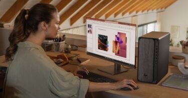 HP OmniDesk desktop shown in a home workspace scene