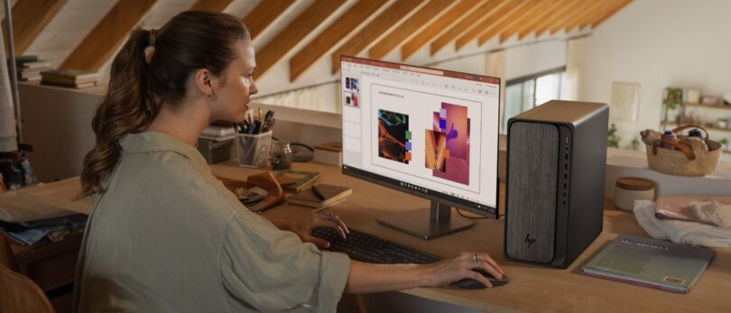 HP OmniDesk desktop shown in a home workspace scene
