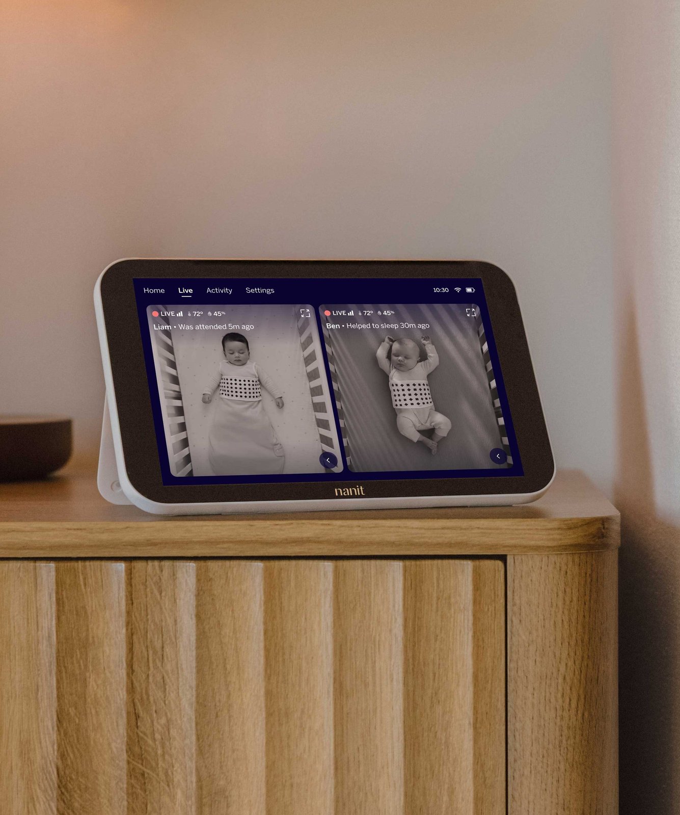 Nanit baby monitor on a dresser