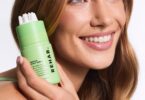 Model holding Matcha Scalp Serum
