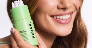 Model holding Matcha Scalp Serum