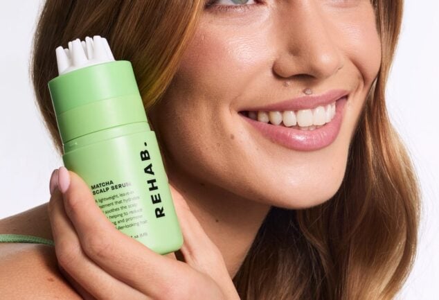 Model holding Matcha Scalp Serum