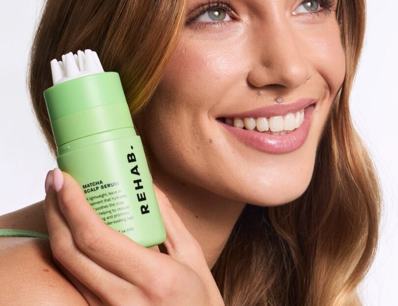 Model holding Matcha Scalp Serum