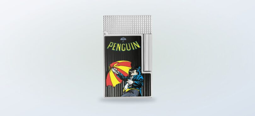 ST Dupont lighter featuring a penguin graphic